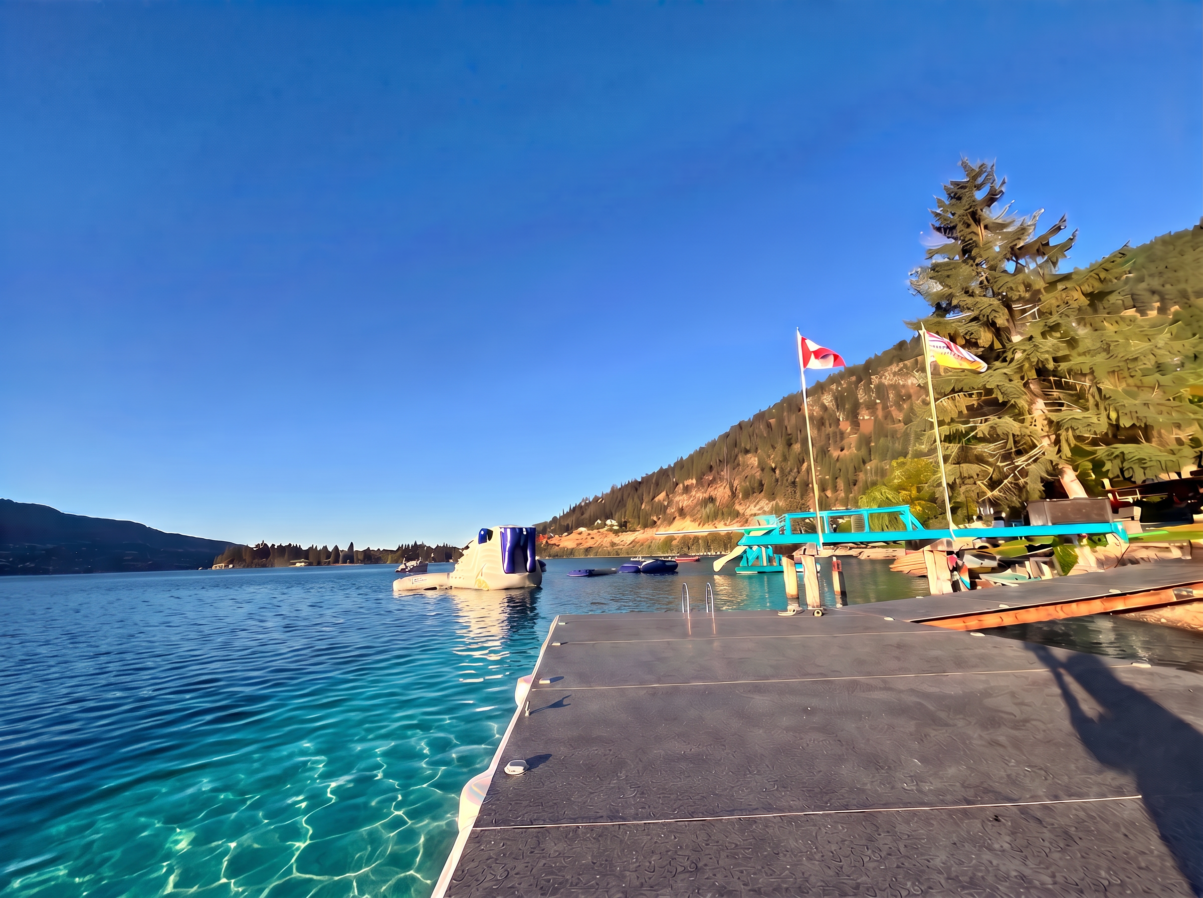 Docks and floating water park on Kalamalka Lake at Klub Kalamalka